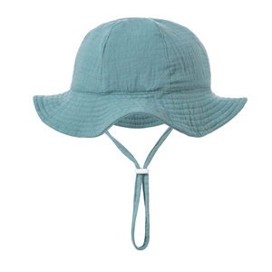 Detail of cotton gauze sun hat with adjustable windproof drawstring and soft texture