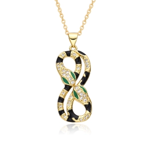 Detailed view of a gold snake pendant necklace with black enamel and green eyes