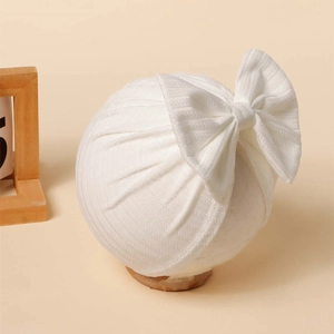 White newborn baby turban hat with a large bow, soft ribbed jacquard fabric for infants
