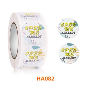 Detail view of round floral stickers featuring Open Me Already text and HA082 model code