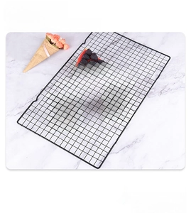 Detailed close-up of a non-stick rectangular baking cooling rack with a fine mesh grid