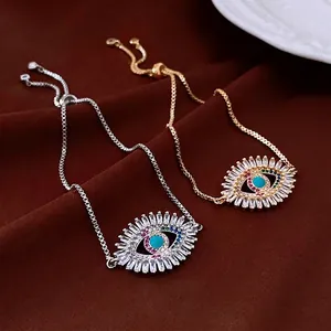 Adjustable evil eye charm bracelet with baguette-cut zircon eyelashes in gold and silver