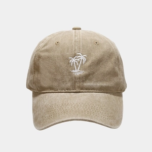 Detailed close-up of palm tree embroidery on washed cotton vintage baseball cap