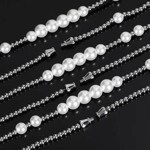 Detail of hip hop stainless steel ball chain with integrated white glass pearl accents