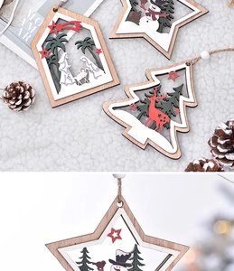 Detail of wooden Christmas ornaments featuring star and house shapes with nativity scene