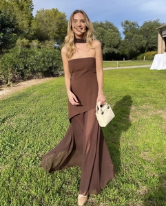 Detailed texture of brown chiffon strapless top and flowing maxi skirt set in natural light