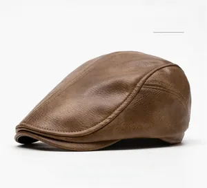 Close-up of coffee brown PU leather ivy cap showing retro lychee grain texture and stitching