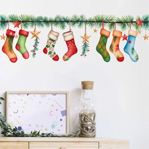 Christmas wall decals with colorful stockings, stars, and green pine branches for home decor