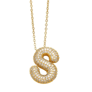 Close-up of golden balloon letter S pendant necklace with shimmering diamond accents
