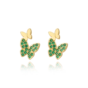 Detail of gold butterfly studs featuring vibrant green zircon stones on white background