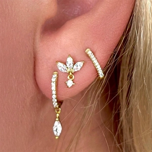 Close-up of golden S925 sterling silver hoop earring set with marquise zircon and studs