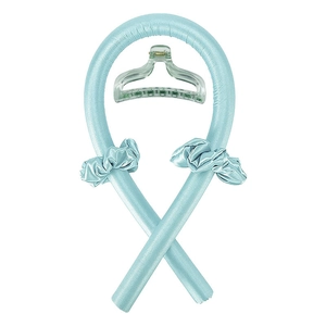 Detail of light blue heatless hair curler set with silk rollers, scrunchies and clear clip
