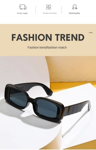 Detail of wide black rectangular sunglasses frame with stylish wavy temple design