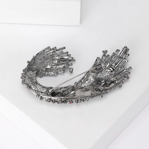 Detailed back view of vintage ocean wave brooch showing secure pin clasp and metal texture
