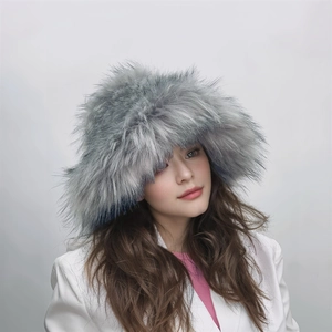 Detail shot of fluffy grey-blue faux fox fur hat with thick long plush texture