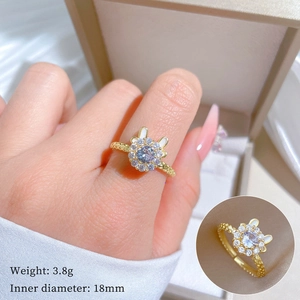 Gold plated open ring with rabbit ear design and round cubic zirconia stones for women