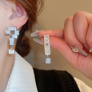 Asymmetric zircon question and exclamation mark stud earrings in silver finish
