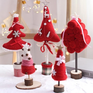Miniature red and white felt Christmas tree ornaments with wooden bases for holiday decor