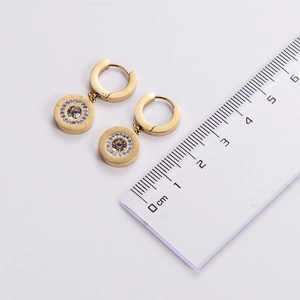 Detailed view of 18k gold Roman numeral earrings with crystal inlay and size measurement