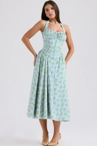 Detail of light blue floral print midi dress with halter neck and slim bodice design