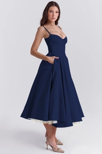 Detail view of navy satin dress showing the sweetheart neckline and delicate spaghetti straps
