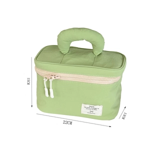 Detail view showing dimensions 22x13x15cm for a large green nylon toiletry bag