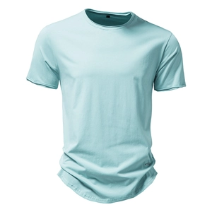 Detail view of cotton t-shirt fabric and small metal hardware on the hemline