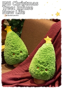 Detail of plush Christmas tree doll with golden star topper and cute embroidered face