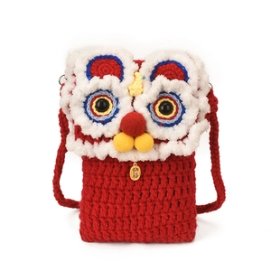 Red crocheted children's crossbody bag with festive lion dance design for Lunar New Year