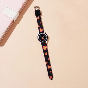 Close-up of kids' quartz watch dial with colorful numbers and rainbow heart strap