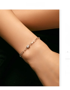 Detailed view of an S925 sterling silver paperclip bracelet with square-cut moissanite