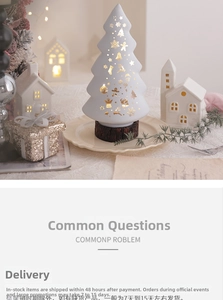 Close-up of a white ceramic Christmas tree lamp with golden stars on a wood base