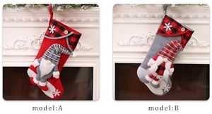 Detail of Christmas stockings featuring 3D plush gnomes and classic plaid cuffs for decor
