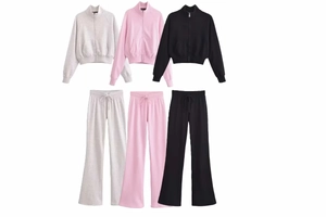 Detailed flat lay of cotton high neck zip-up hoodies and matching flared sweatpants in grey, pink, and black