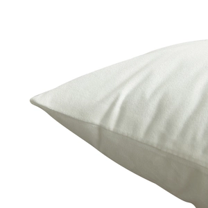 Christmas pillow cover with festive gold foil patterns on white fabric texture