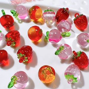 DIY colorful resin fruit pendants including strawberry and apple shapes for jewelry making