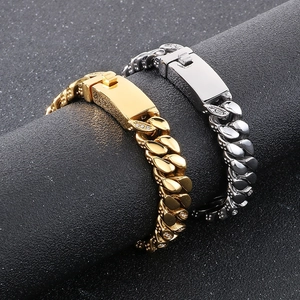 Detail of 12mm hip hop Cuban link bracelets in gold and silver with studded rhinestones