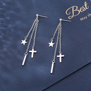 Silver dangling earrings with star, cross, and bar pendants on long delicate chains