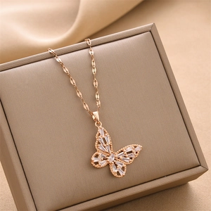 Titanium butterfly pendant necklace with white zircon on jewelry box and silk background