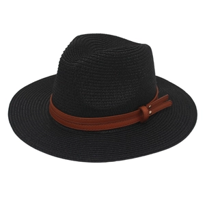 Detail of black straw fedora hat featuring a brown leatherette band with metallic rivet
