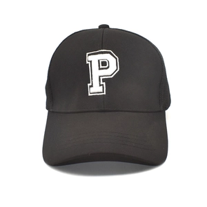 Close-up of black baseball cap featuring a white embroidered letter P on the front crown