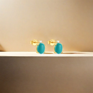 Detail of S925 sterling silver stamp on gold flower stud earrings with turquoise