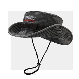 Macro detail of washed grey canvas sun hat with wide brim and offshore embroidery
