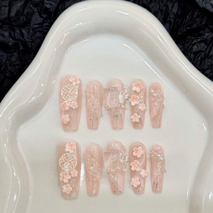 Handmade light pink coffin press-on nails with 3D floral accents and ice-effect charms