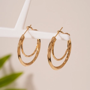 Minimalist double layered geometric gold hoop earrings with faceted diamond texture