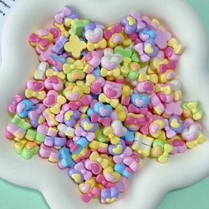 Assorted colorful resin heart and flower charms for DIY hair clips and crafts