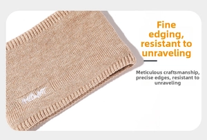 Close-up of khaki knitted snood featuring MLDWMT embroidery and ribbed edge detail