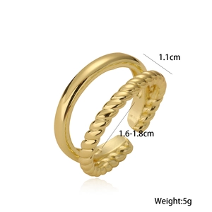 Gold-plated geometric open ring featuring smooth and twisted double layers on white background