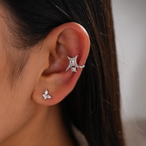 Minimalist silver ear cuff set with star and butterfly motifs in zircon-studded metal