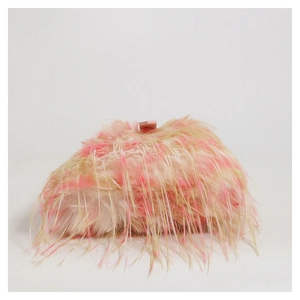Macro shot of fluffy faux fur texture on a pink and beige plush shoulder bag detail